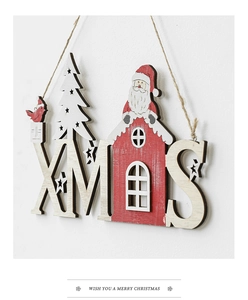 Close-up of wooden XMAS letter sign with Santa Claus and festive bird decoration