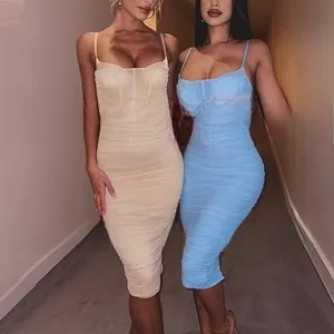 Detail of ruched slim-fit midi dresses in cream and light blue with thin straps