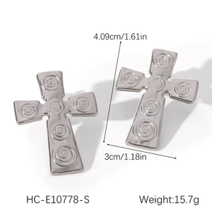 Detailed view of silver cross earrings with spiral texture and size specifications
