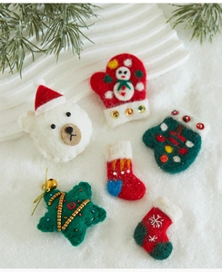Detailed view of handmade Christmas wool felt ornaments with beads and sequins