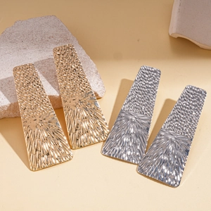 Metallic geometric square hair clips with textured radial hammer pattern in gold and silver