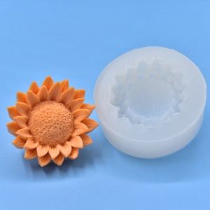 Sunflower shaped silicone mold for DIY crafts with finished orange floral resin product