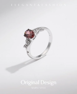 Macro view of S925 sterling silver ring showing the inner stamp and red gemstone detail