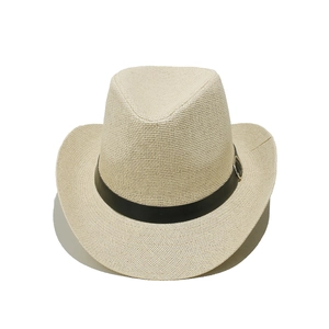 Detail of cream woven straw hat with black leather band and silver buckle accents