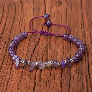 Detail of adjustable purple amethyst beaded bracelet with natural stone chips and copper beads