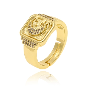 Macro detail of 18K gold plated ring featuring engraved crescent moon and star patterns