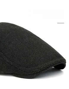Detail of herringbone wool beret with foldable brim and widened peak for face shaping