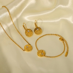 Gold 18K plated stainless steel jewelry set with sun and moon celestial relief design