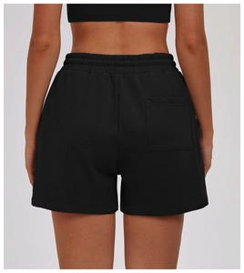 Detail view of high-waist athletic shorts featuring a practical back pocket and soft fabric