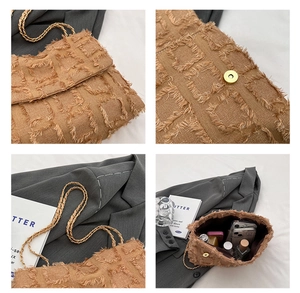 Brown textured bag details showing gold chain, magnetic buckle, and interior capacity