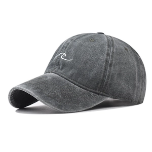 Detail of grey washed cotton baseball cap featuring white wave embroidery and stitching
