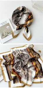 Close-up of leopard and floral print silk scarf featuring a satin glossy texture
