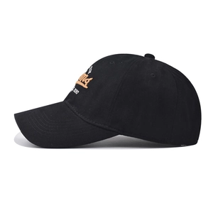 Detail of the high-quality orange 'mind' and white '2030' embroidery on black cotton cap