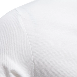 Close-up of white piqué knit cotton fabric showing breathable mesh texture and detail