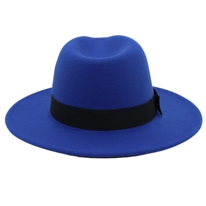 Detail of royal blue wool fedora hat with a black ribbed ribbon and small side bow