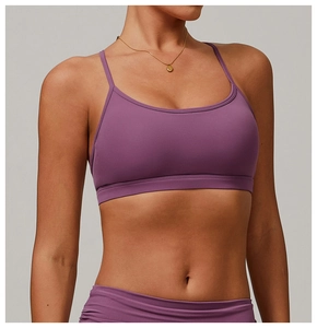 Detail of purple yoga bra with slim straps and U-neckline in a smooth premium fabric