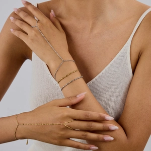 18K gold plated stainless steel ring-bracelet hand chain worn on model for women