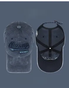 Detailed view of embroidery and inner sweatband of navy washed cotton baseball cap