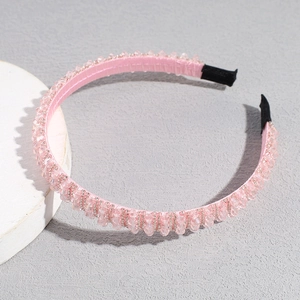 Detail of pink crystal beaded headband with comfortable black non-slip ends and fabric wrap