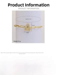 Detailed view of gold 18k paperclip chain bracelet with a pavé letter A charm and sizing