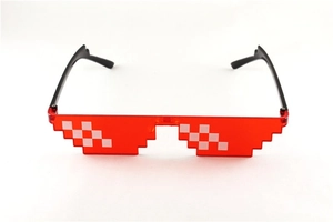 Detail of translucent red pixel sunglasses with 8-bit edge design for cool party looks
