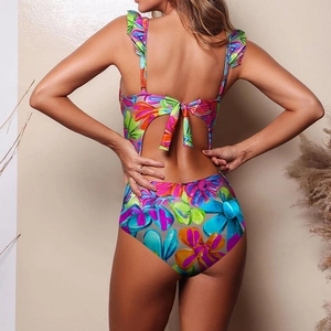 Detailed back view of floral ruffled bikini with cutout design and tie-back bow detail
