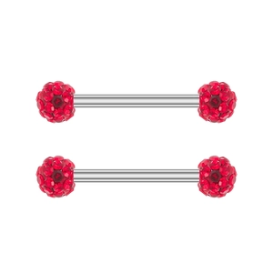 Macro view of silver stainless steel nipple barbells with brilliant red zircon crystal balls
