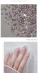 Macro view of tiny colorful flatback zircons and elegant nude gradient nail art design
