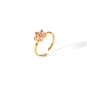 Macro shot of gold flower ring featuring purple zircon petals and adjustable open band