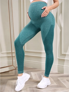 Detail of high-waist seamless maternity yoga leggings with breathable mesh patterns