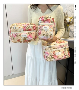 Detailed set of three floral quilted cotton cosmetic bags with vintage flower patterns