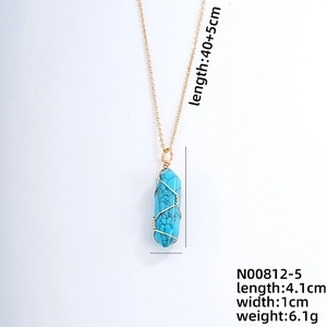 Detailed view of turquoise hexagonal pendant with gold wire wrap and dimension markings