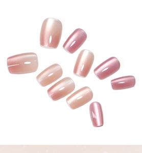Short square pink cat eye press-on nails with shimmering gradient and pearlescent finish