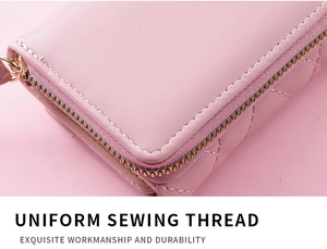 Detailed close-up of high-quality sewing thread and quilting on pink leather wallet