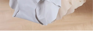 Close-up of seamless wavy edge craft and silky fabric on beige and grey underwear