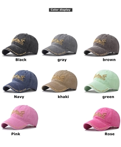 Detail of multi-color washed cotton baseball caps with 3D embroidery and vintage texture