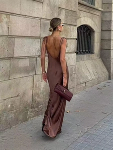 Elegant deep brown satin slip maxi dress with open back and sleek minimalist silhouette