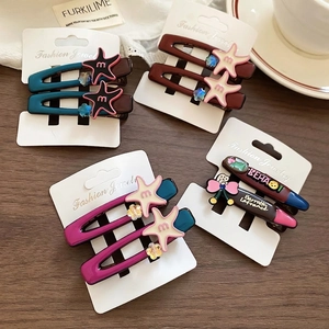 Star-shaped acrylic hair clips set with dopamine colors on a display card