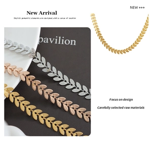 Macro detail of leaf pattern necklaces in silver gold and rose gold finishes