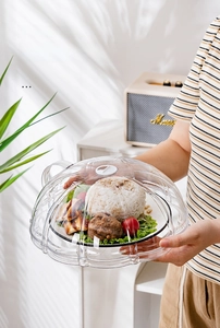 Close-up of food-grade microwave cover with adjustable vent and clear petal design