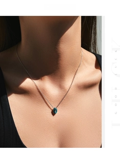 Close-up of a mint green marquise-cut gemstone pendant necklace on S925 silver chain