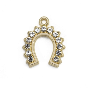 Macro detail of gold-plated horseshoe pendant with inlaid white crystals for DIY jewelry