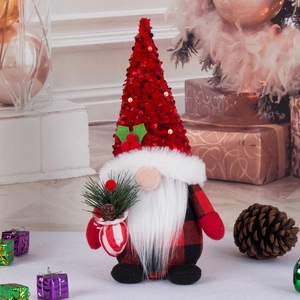 Christmas gnome doll with red sequin hat and plaid body in a festive holiday setting