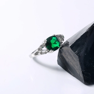 Detailed view of silver ring featuring a square deep blue gemstone and micro-pave zircons