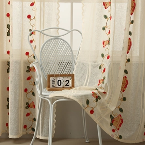 Embroidered Christmas tablecloth with red bells and green holly on lace fabric