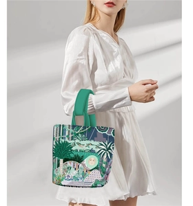Artistic Van Gogh oil painting style bucket bag carried by model in white dress
