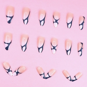 Minimalist almond shape press-on nails with nude pink base and black abstract line art