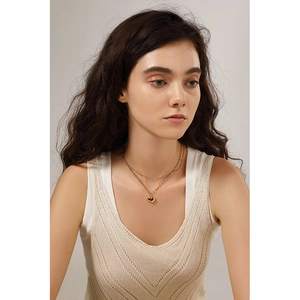 Double-layered gold heart pendant necklace featuring thin and thick chain design for women