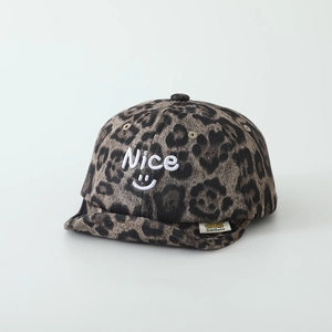 Close-up of leopard print baby cap with Nice embroidery and soft brim detail