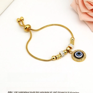 Gold stainless steel evil eye bracelet with adjustable slider chain and zircon stones